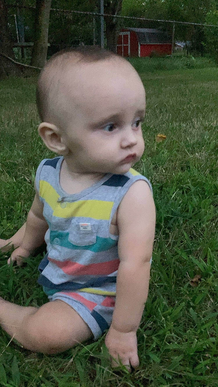 Lakeston joined the competition — help win amazing prizes! baby, baby_toddler_clothing, blond, cheek, eye, face, facial_expression, fun, grass, grass_family, head, iris, lawn, meadow, pattern, people_in_nature, person, plant, sitting, skin