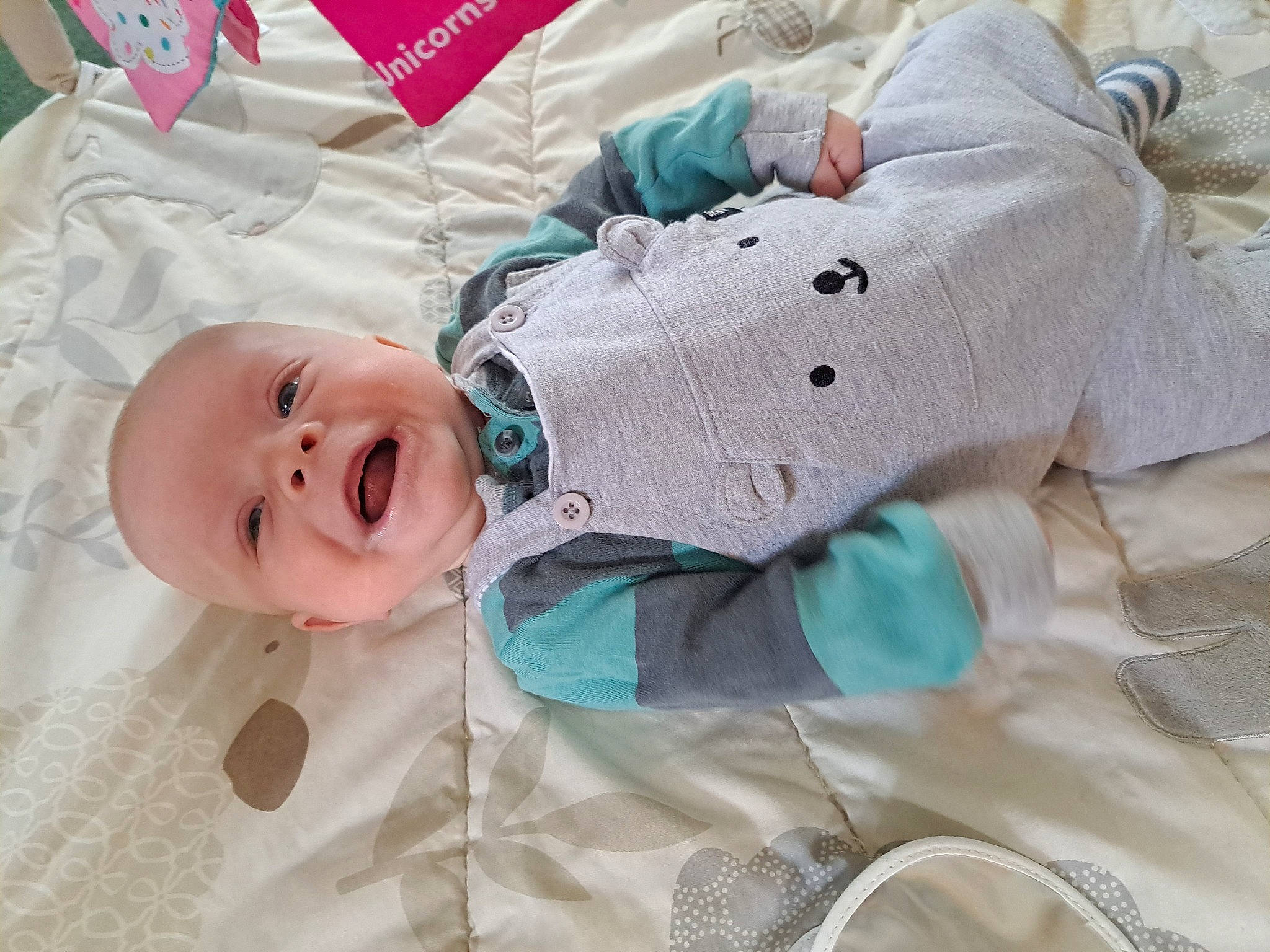 Johnathon is registered to the contest to win money with this photo: baby, baby_products, baby_safety, baby_sleeping, baby_toddler_clothing, bedding, bedtime, child, comfort, event, happy, linens, pattern, person, pink, room, skin, sleeve, smile, textile