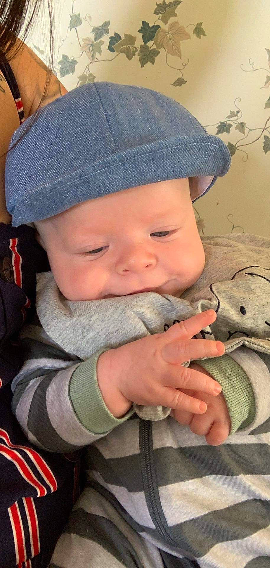 Johnathon is registered to the contest to win money with this photo: baby, baby_toddler_clothing, cap, cheek, child, chin, facial_expression, fashion_accessory, gesture, grass, happy, headwear, lip, mouth, nail, nose, person, skin, smile, thumb