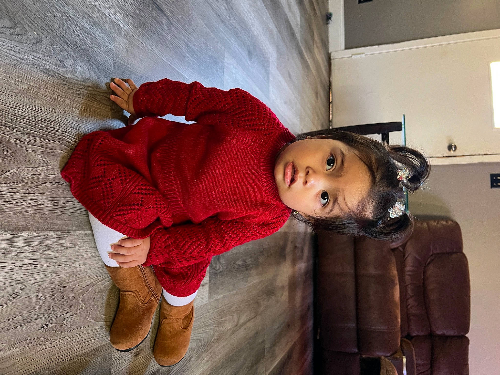 Graciela is registered to the contest to win money with this photo: baby, baby_toddler_clothing, carmine, child, dress, fashion_design, flooring, foot, fun, fur, human_leg, knee, magenta, pattern, person, sitting, sock, textile, thigh, toddler