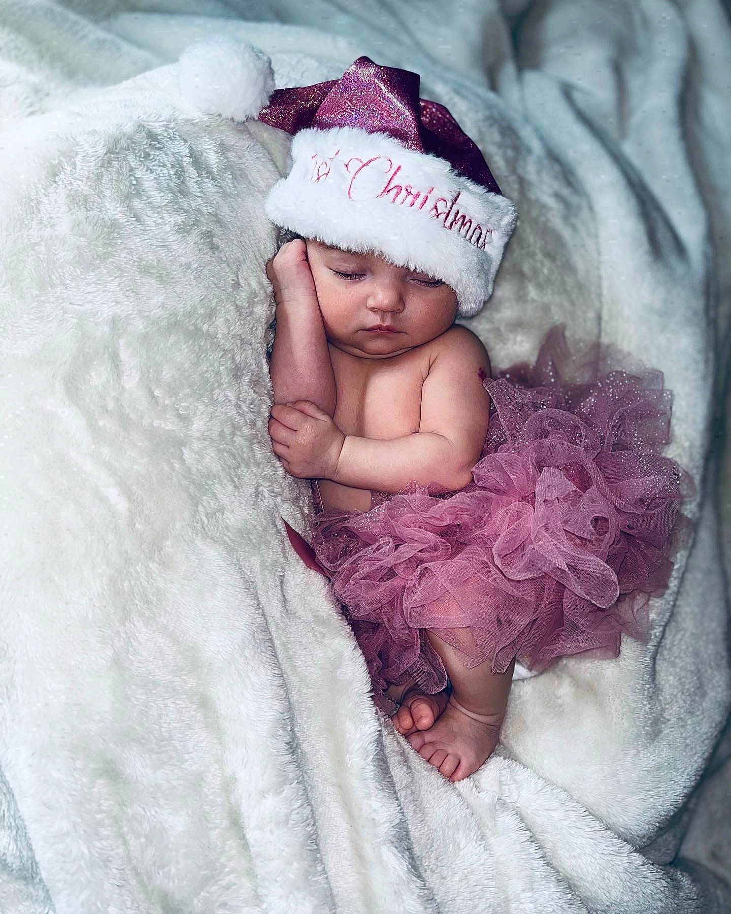 Kylee joined the competition — help win amazing prizes! baby, baby_sleeping, baby_toddler_clothing, bedding, cap, child, comfort, face, fashion_accessory, fur, hair_accessory, headgear, headwear, knit_cap, linens, magenta, person, pink, purple, textile