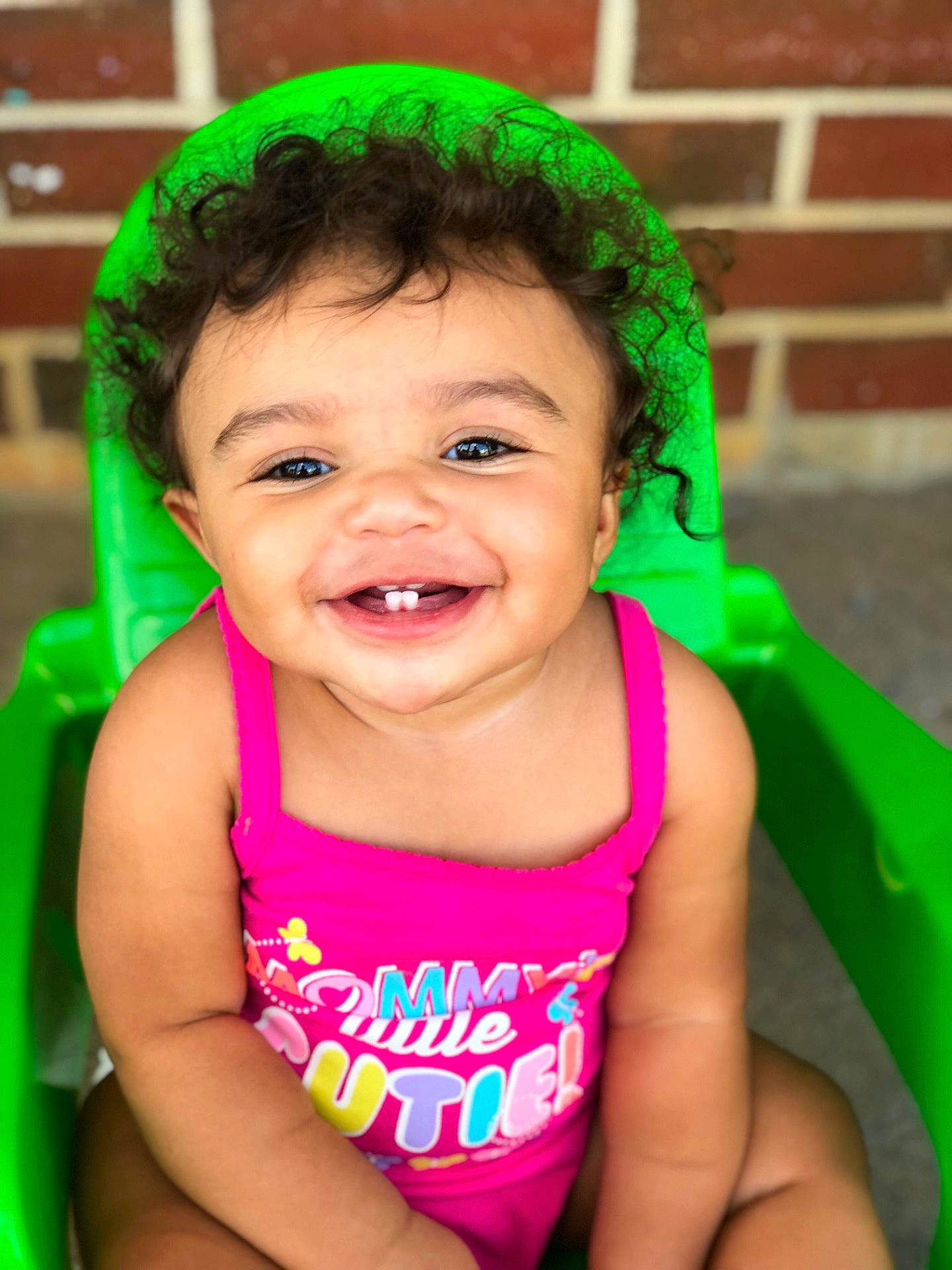 Zamya is registered to the contest to win money with this photo: black_hair, boy, cheek, child, eye, face, facial_expression, fun, girl, green, happiness, infant, joy, laughter, mouth, organ, person, pink, play, skin