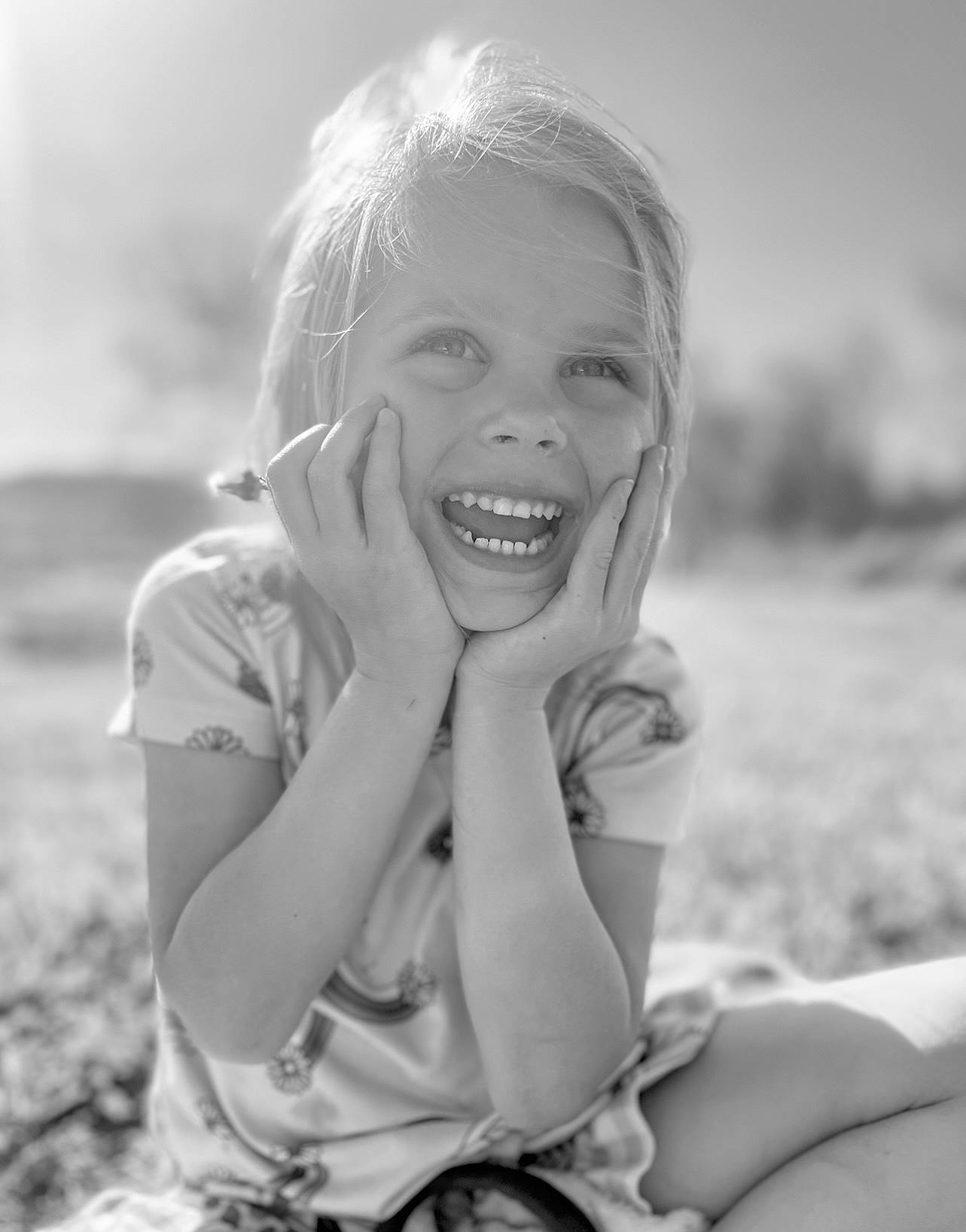 Hailee is registered to the contest to win money with this photo: black_and_white, flash_photography, fun, gesture, grass, grassland, hair, hand, happy, iris, lip, long_hair, meadow, monochrome, people_in_nature, person, plant, skin, smile, style