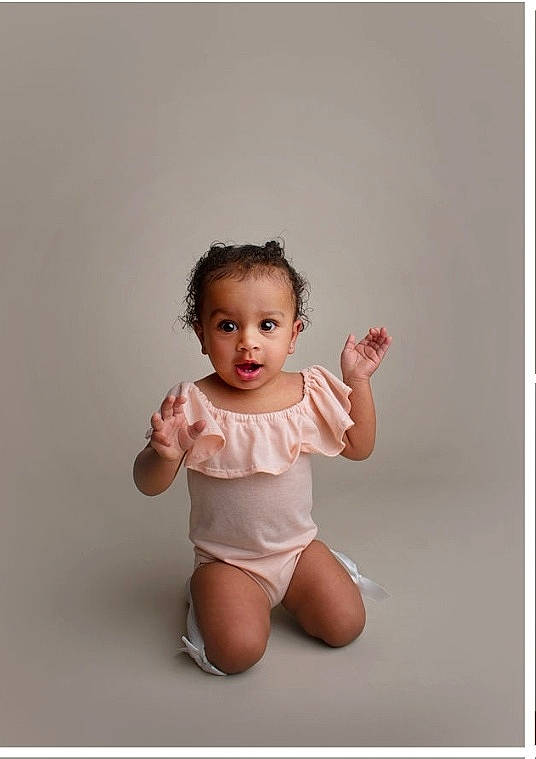 Carly is registered to the contest to win money with this photo: arm, baby, child, child_model, gesture, hand, person, photo_shoot, photograph, photography, pink, portrait, portrait_photography, shoe, sitting, standing, stock_photography, surprise, toddler, white
