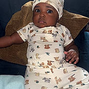 Zailyn joined the competition — help win amazing prizes! baby, infant, child, couch, pillow, blanket, onesie, hat, animal_print, cute, indoors, portrait, relaxed, looking_up, soft_toys, furniture, cozy, sleepwear, hand, face