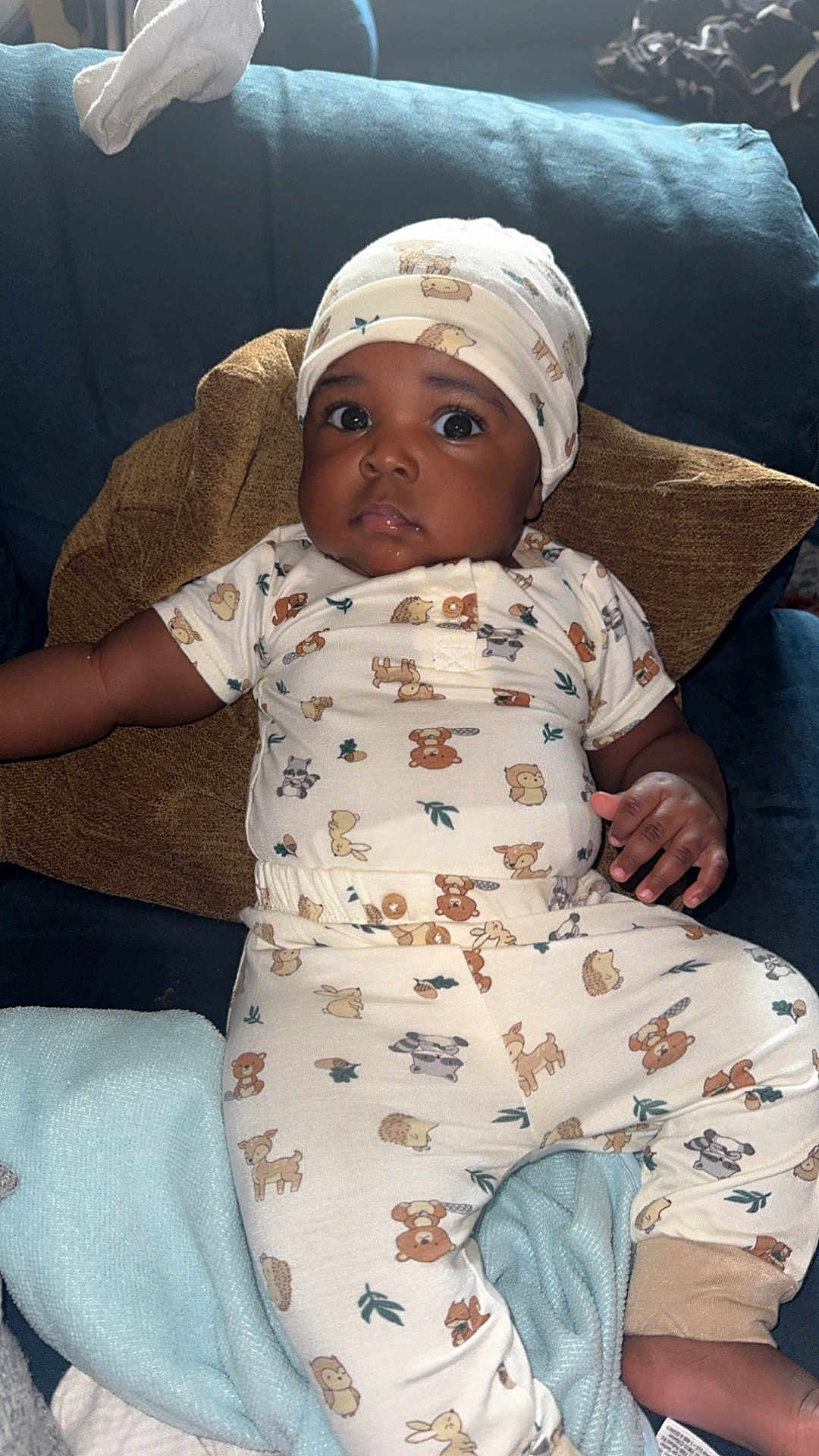 Zailyn joined the competition — help win amazing prizes! baby, infant, child, couch, pillow, blanket, onesie, hat, animal_print, cute, indoors, portrait, relaxed, looking_up, soft_toys, furniture, cozy, sleepwear, hand, face