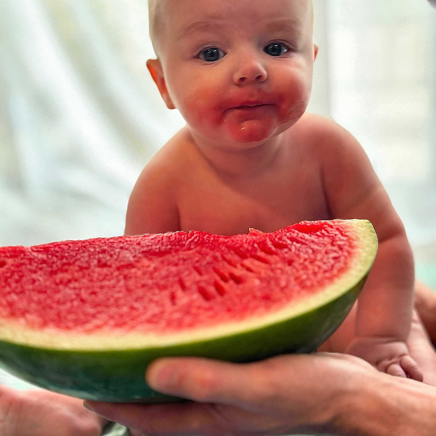 Heath is registered to the contest to win money with this photo: baby, background, closeup, curious, cute, expression, face, food, fresh, fruit, hand, healthy, infant, juice, mouth, person, sitting, skin, summer, watermelon