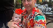 Antonia joined the competition — help win amazing prizes! adult, baby, chair, child, cuddling, family, father, floral_shirt, flower, glass_windows, hibiscus, outdoor_dining, portrait, restaurant, selfie, smiling, sunglasses, sunlight, table, waiter