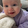 baby, child, infant, smiling, portrait, face, eyes, blue_eyes, indoor, couch, blanket, fluffy_blanket, lavender_clothing, purple, sitting, close_up, happy, adorable, home, photography
