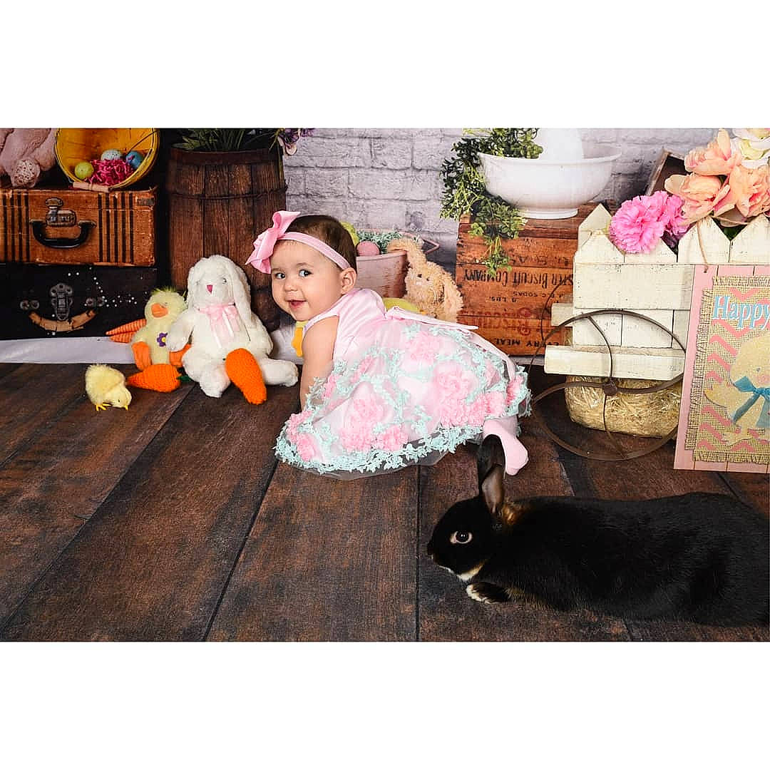 Xiomara is registered to the contest to win money with this photo: beauty, beige, child, dress, ear, floor, flooring, footwear, fur, furniture, person, pink, play, product, room, sitting, snapshot, table, textile, toddler
