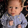 baby, infant, face, eyes, ears, clothing, onesie, patterned_blanket, animal_print, purple, bee_print, hand, fist, curious, indoors, portrait, skin, red_hair, cute, child