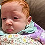 Emery joined the competition — help win amazing prizes! baby, red_hair, pout, drool, blanket, floral_pattern, purple_clothing, white_flowers, face, head, skin, infant, cute, child, person, expression, resting, indoors, closeup, soft_texture