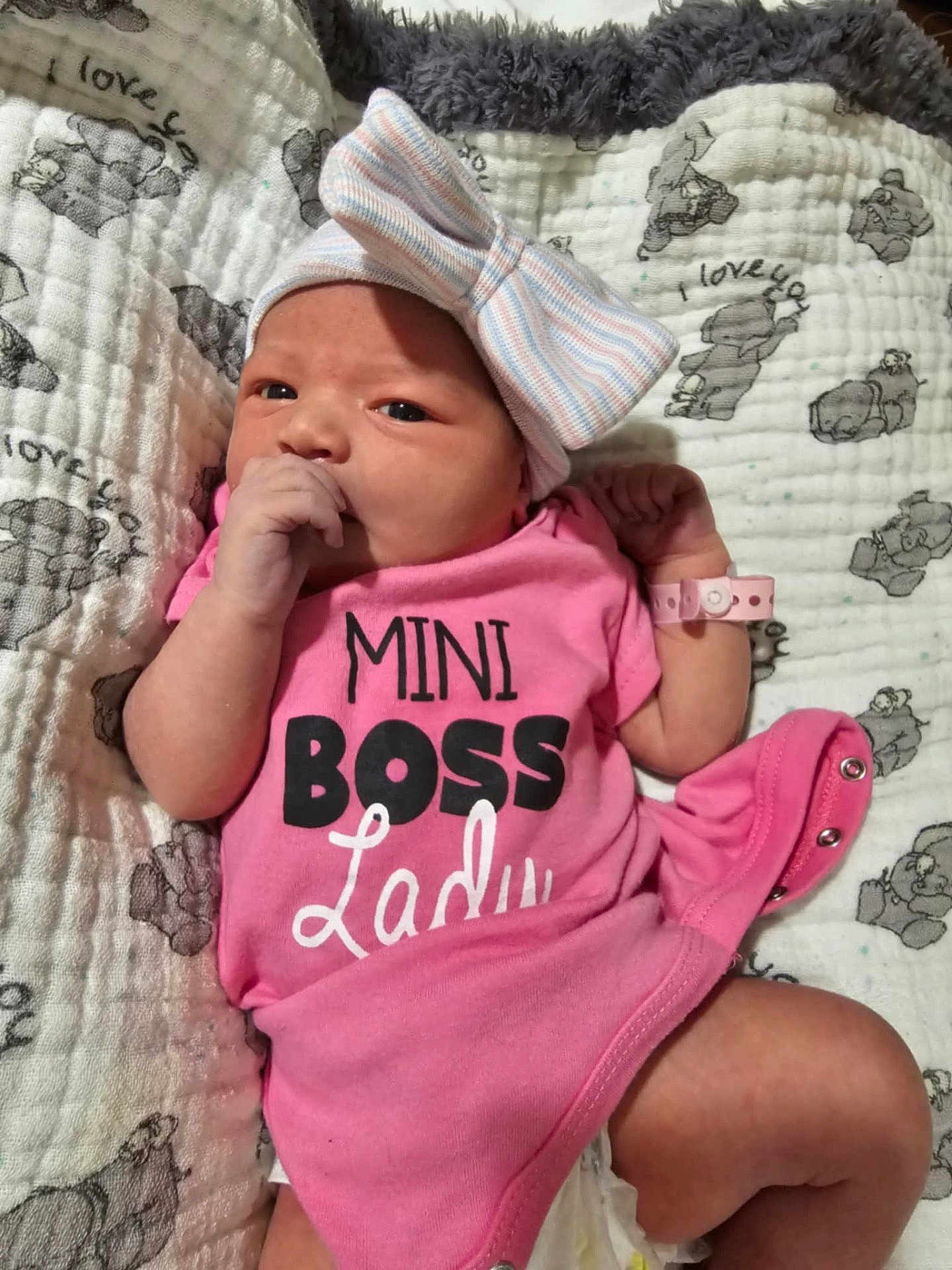 Avery is registered to the contest to win money with this photo: adorable, baby, baby_bracelet, blanket, bow, cute, elephant_print, fabric, face, hand, hat, indoors, infant, lying_down, newborn, onesie, pink_clothing, sleepy, soft_texture, thumb_sucking
