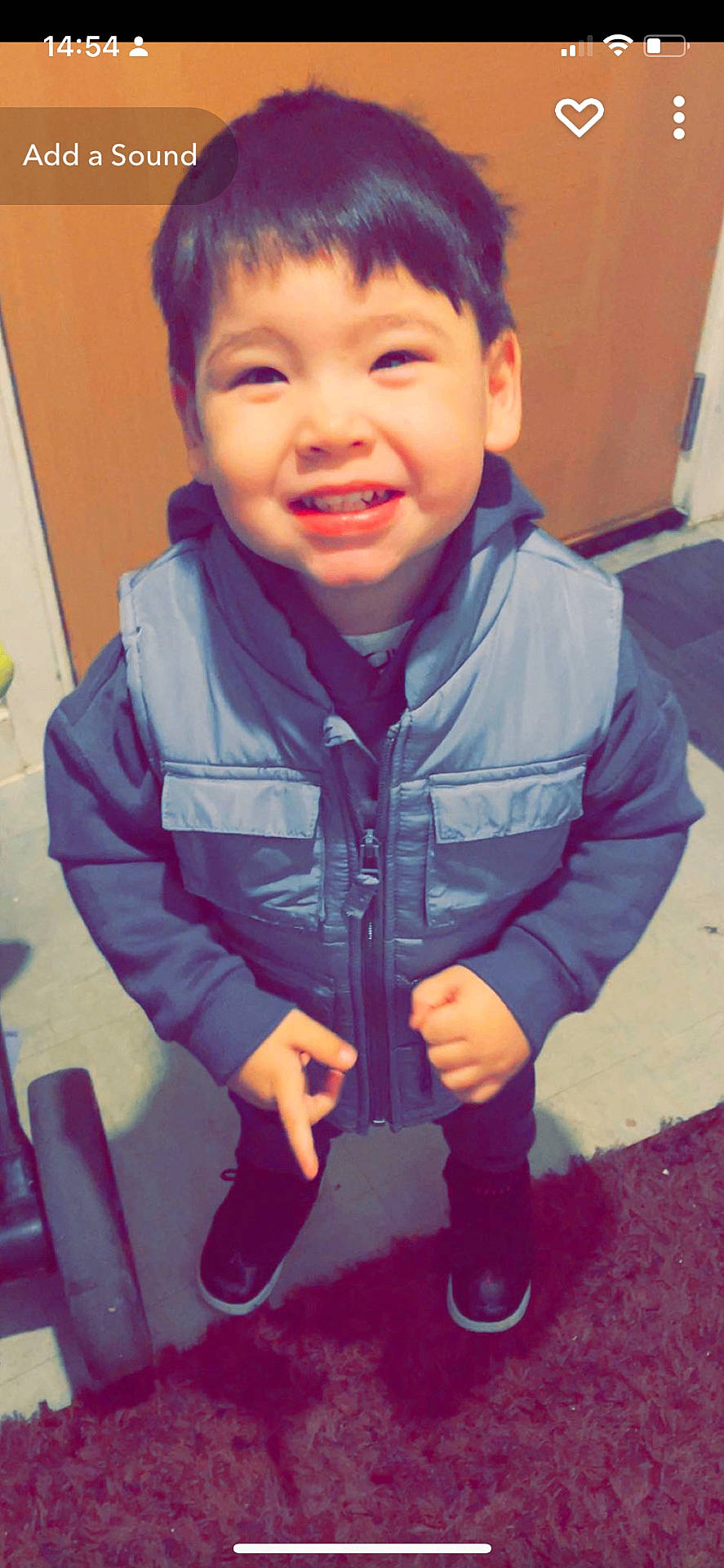 Riley joined the competition — help win amazing prizes! bodypart, boy, child, clothing, coat, face, finger, hand, happy, head, jacket, jeans, male, mouth, pants, person, photography, portrait, smile, teeth