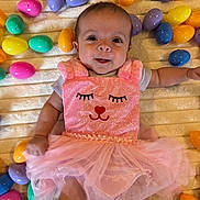 Patricia joined the competition — help win amazing prizes! baby, infant, smiling, pink_dress, tutu, easter_eggs, colorful, plastic_eggs, blanket, cute, happy, face, child, lying_down, soft_texture, indoors, playful, festive, celebration, adorable