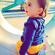 Lyza participe au concours pour gagner de l'argent avec cette photo : baby, clothing, face, footwear, grass, head, nature, outdoorplayarea, outdoors, pants, park, person, photography, plant, playarea, portrait, shoe, shorts, slide, toy