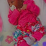 Angela Sidney participe au concours pour gagner de l'argent avec cette photo : baby, pacifier, headband, bow, pink_clothing, floral_pants, socks, blanket, colorful, heart_shapes, flower_patterns, infant, resting, cute, soft_texture, indoors, sleepy, child, newborn, cozy