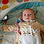 Marius a rejoint le concours — aidez-le/la à gagner de superbes lots ! baby, infant, child, blanket, striped_clothing, tiger_pattern, pacifier_clip, crib, toy, soft_toys, colorful_background, cute, lying_down, face, expression, young_child, indoors, comfort, warm_colors, playful