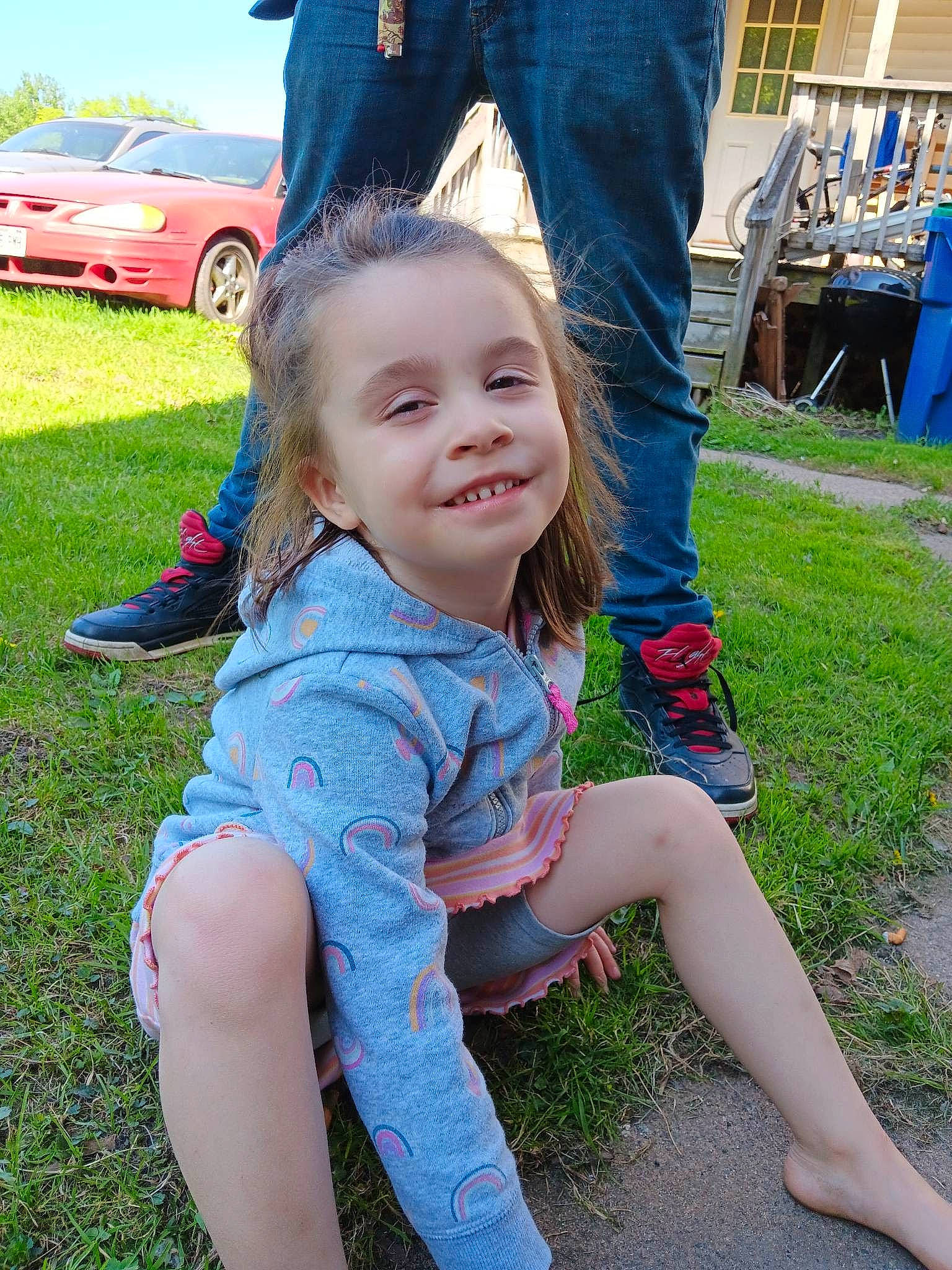 Meah is registered to the contest to win money with this photo: blue, car, electric_blue, fun, grass, grass_family, happy, jeans, joy, lawn, leaf, leisure, person, plant, public_space, recreation, smile, summer, tire, toddler