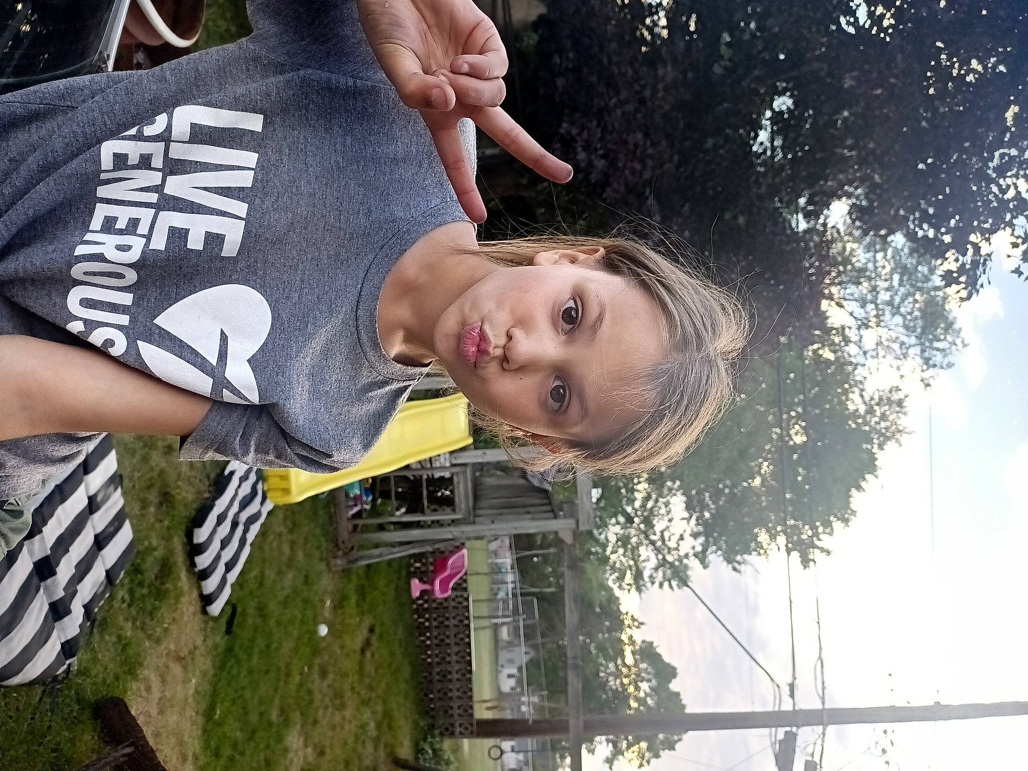 Lily joined the competition — help win amazing prizes! child, cloud, cool, fun, gesture, grass, happy, leisure, person, plant, recreation, sky, smile, sportswear, spring, t_shirt, tree, water, woody_plant