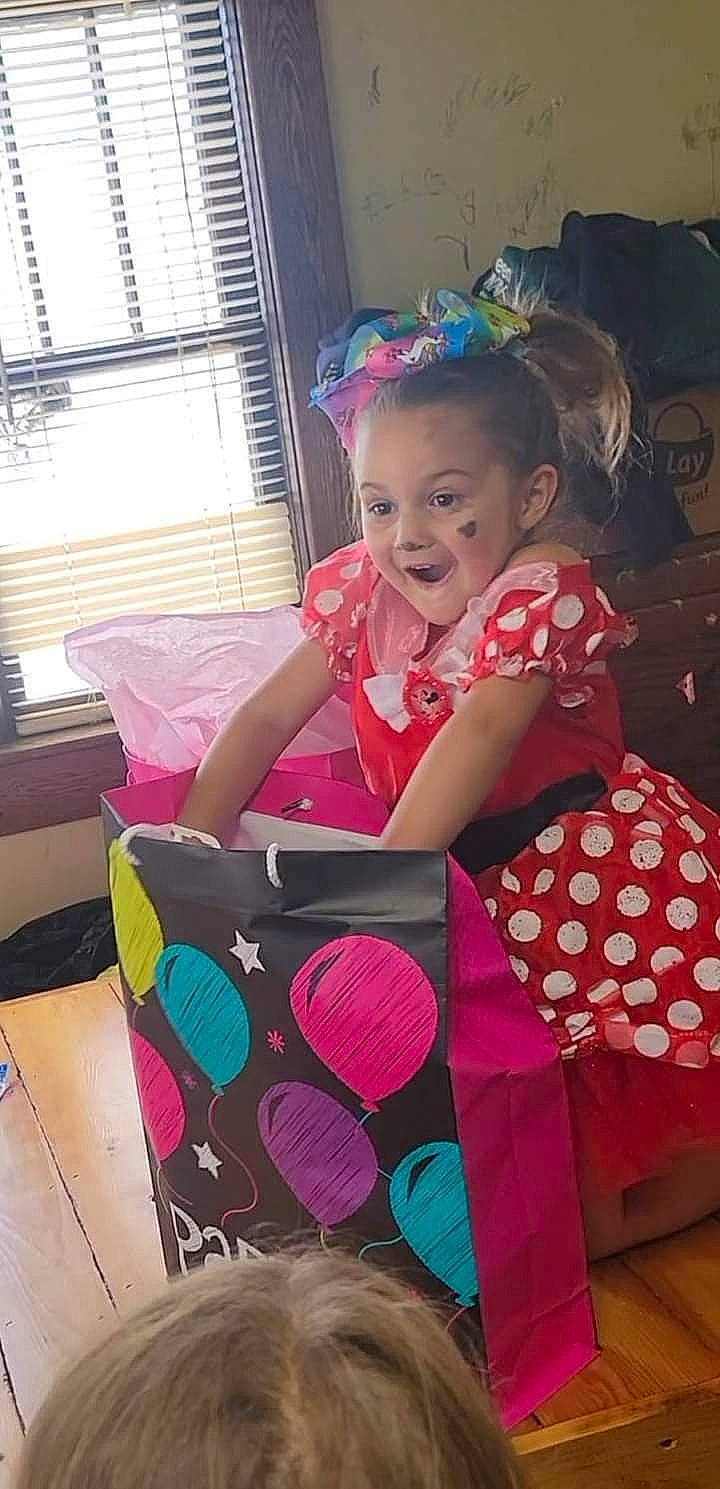 Harper Grace is registered to the contest to win money with this photo: baby_products, baby_toddler_clothing, bag, child, design, dress, event, fun, happy, linens, magenta, party, pattern, person, pink, purple, sitting, smile, toddler, window