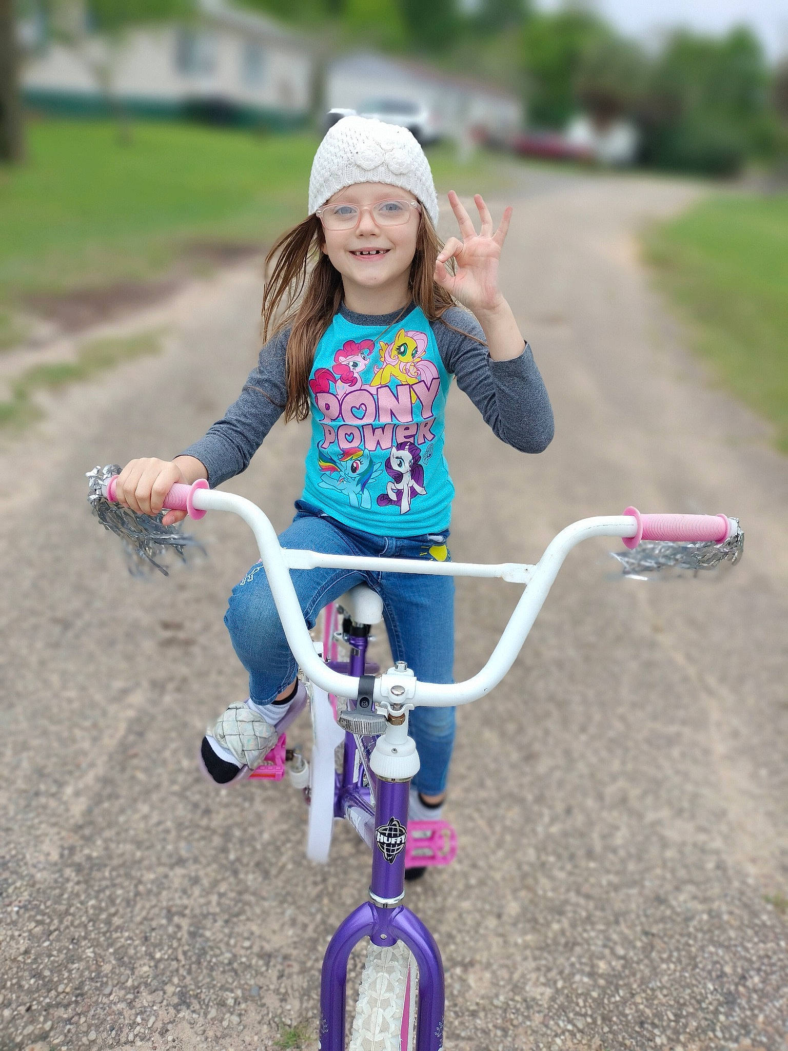 Amberly is registered to the contest to win money with this photo: bicycle, bicycle_accessory, bicycle_frame, bicycle_handlebar, bicycle_tire, bicycle_wheel, bicycles_equipment_and_supplies, fun, grass, happy, headwear, joy, leisure, outdoor_recreation, person, photograph, pink, recreation, smile, tire