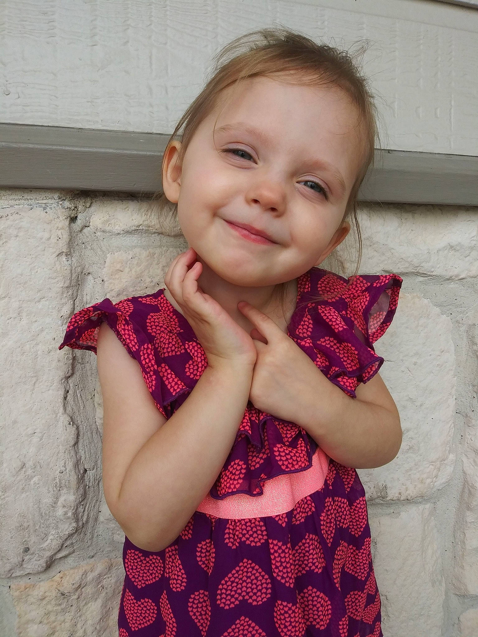 Amberly is registered to the contest to win money with this photo: arm, baby_toddler_clothing, cheek, chin, facial_expression, finger, gesture, hair, happy, head, iris, joy, lip, neck, person, pink, shoulder, skin, sleeve, smile