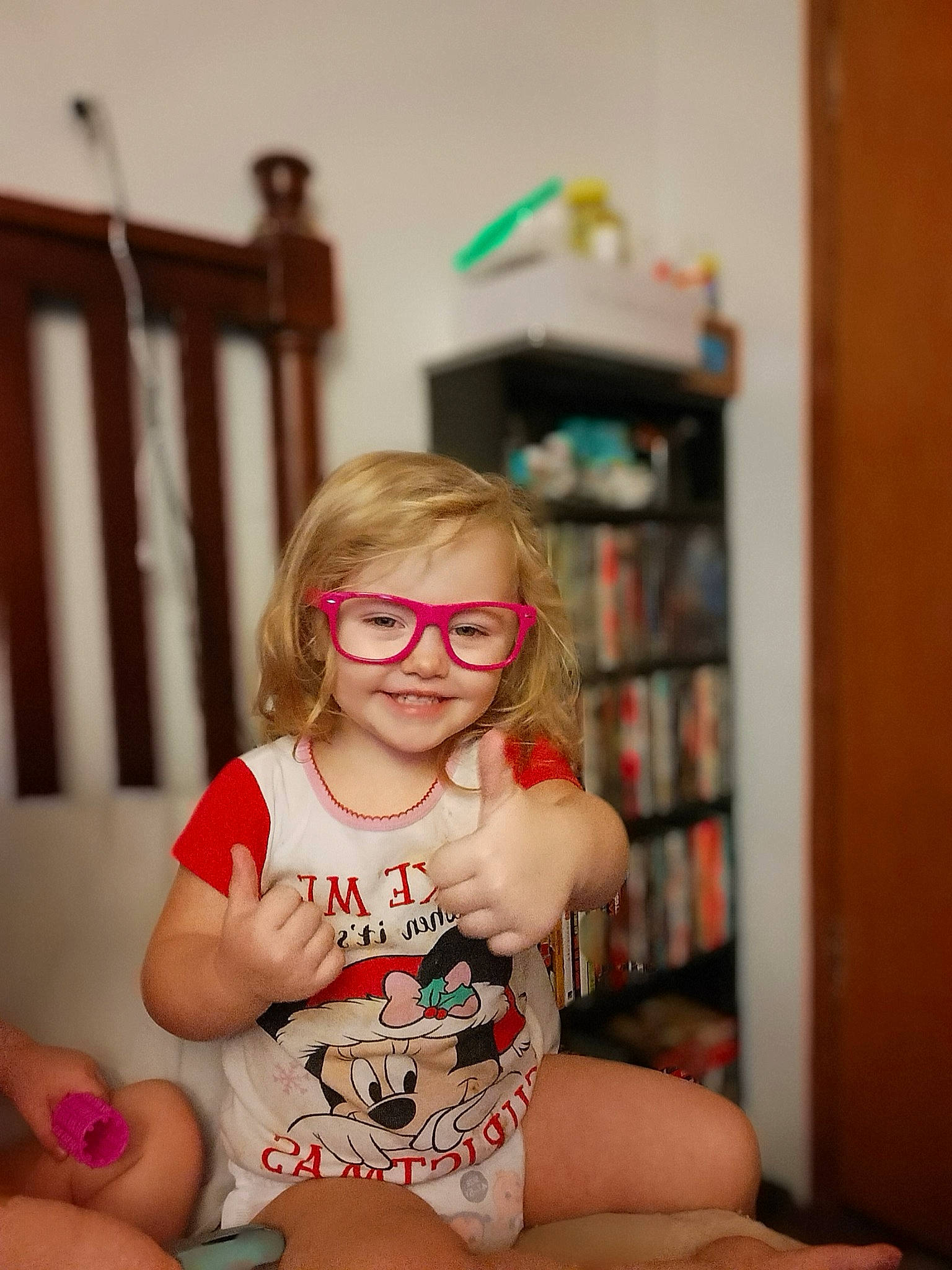 Nova joined the competition — help win amazing prizes! baby_toddler_clothing, blond, bookcase, eye, eyewear, flooring, fun, hairstyle, happy, human_leg, joy, knee, lap, leg, long_hair, person, shelf, smile, standing, thigh