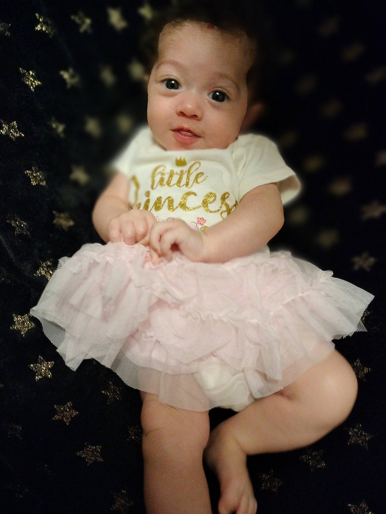 Gabrielle joined the competition — help win amazing prizes! baby, baby_toddler_clothing, blond, cheek, child, day_dress, embellishment, face, flash_photography, happy, iris, one_piece_garment, pattern, person, pink, ruffle, sitting, skin, sleeve, smile