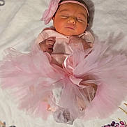 Genevieve joined the competition — help win amazing prizes! newborn, baby, sleeping, pink, tutu, headband, flower, blanket, soft, cute, infant, portrait, clothing, sleep, rest, toddler, child, peaceful, hands, feet