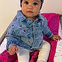 toddler, child, denim_jacket, headband, white_shoes, pink_towel, changing_table, curly_hair, indoor, cute, sitting, expression, clothing, footwear, baby, white_leggings, person, portrait, casual, fashion