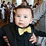 John Ethan Bedoya joined the competition — help win amazing prizes! baby, child, toddler, bow_tie, suit, formal_wear, blue_eyes, portrait, closeup, cute, rosy_cheeks, hair, hand, adult_hand, indoor, event, party, blurred_background, chair, expression