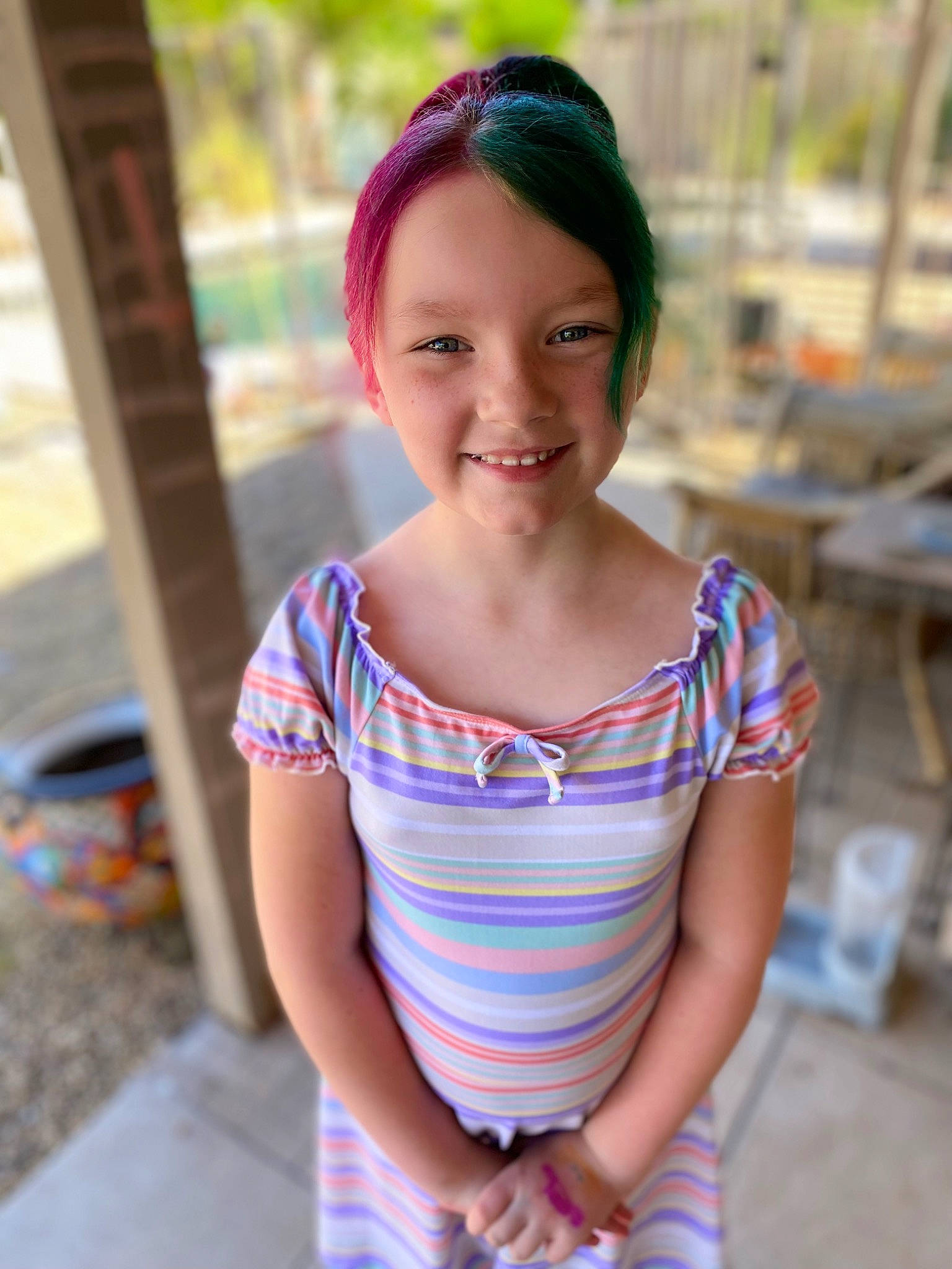 Kaia is registered to the contest to win money with this photo: child, chin, dress, electric_blue, eye, face, fun, hair, happy, joy, leisure, long_hair, neck, pattern, person, recreation, sitting, skin, sleeve, smile