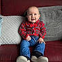 Dexter joined the competition — help win amazing prizes! baby, bow_tie, casual_clothing, child, couch, cozy, cute, face, happy, home, indoor, jeans, person, pillows, plaid_shirt, portrait, shoes, sitting, smiling, young_child