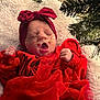 baby, infant, red_clothing, headband, yawning, christmas_tree, holiday, festive, blanket, tulle_skirt, cozy, indoors, sleepy, cute, newborn, face, person, celebration, decorations, festivity