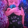 Joey joined the competition — help win amazing prizes! arms_crossed, baby, black_clothing, child, close_up, comfort, cozy, cute, fabric, hand, indoors, infant, newborn, pacifier, patterned_background, person, resting, sleeping, soft_lighting, text_print