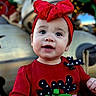 toddler, child, red_clothing, headband, bow, reindeer, holiday, festive, outdoor, portrait, cute, happy, face, smile, christmas, decoration, background, person, young_child, winter