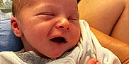 Jace joined the competition — help win amazing prizes! newborn, baby, smiling, face, hand, finger, nail_polish, white_clothing, gray_clothing, blanket, pattern, skin, person, infant, cute, sleeping, happy, holding, closeup, intimate