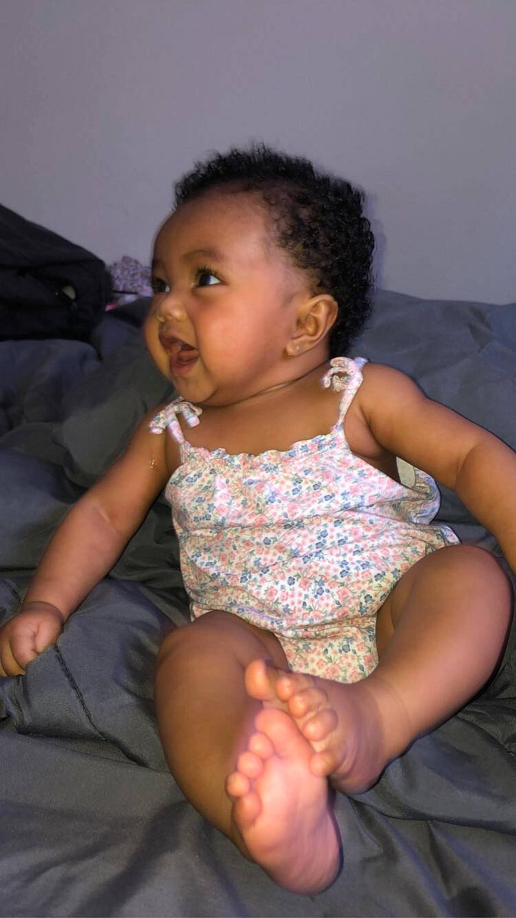 Ayanna is registered to the contest to win money with this photo: abdomen, arm, baby, cheek, child, finger, leg, neck, person, sitting, skin, thigh, toddler, trunk