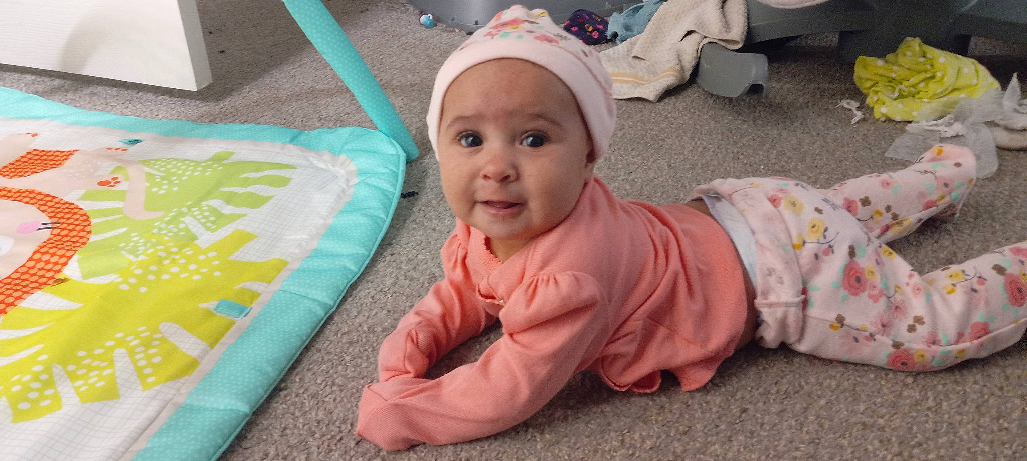 Viviana joined the competition — help win amazing prizes! baby, baby_products, baby_toddler_clothing, cap, cheek, child, comfort, crawling, flooring, foot, fun, grass, headwear, linens, person, pink, play, product, room, sitting
