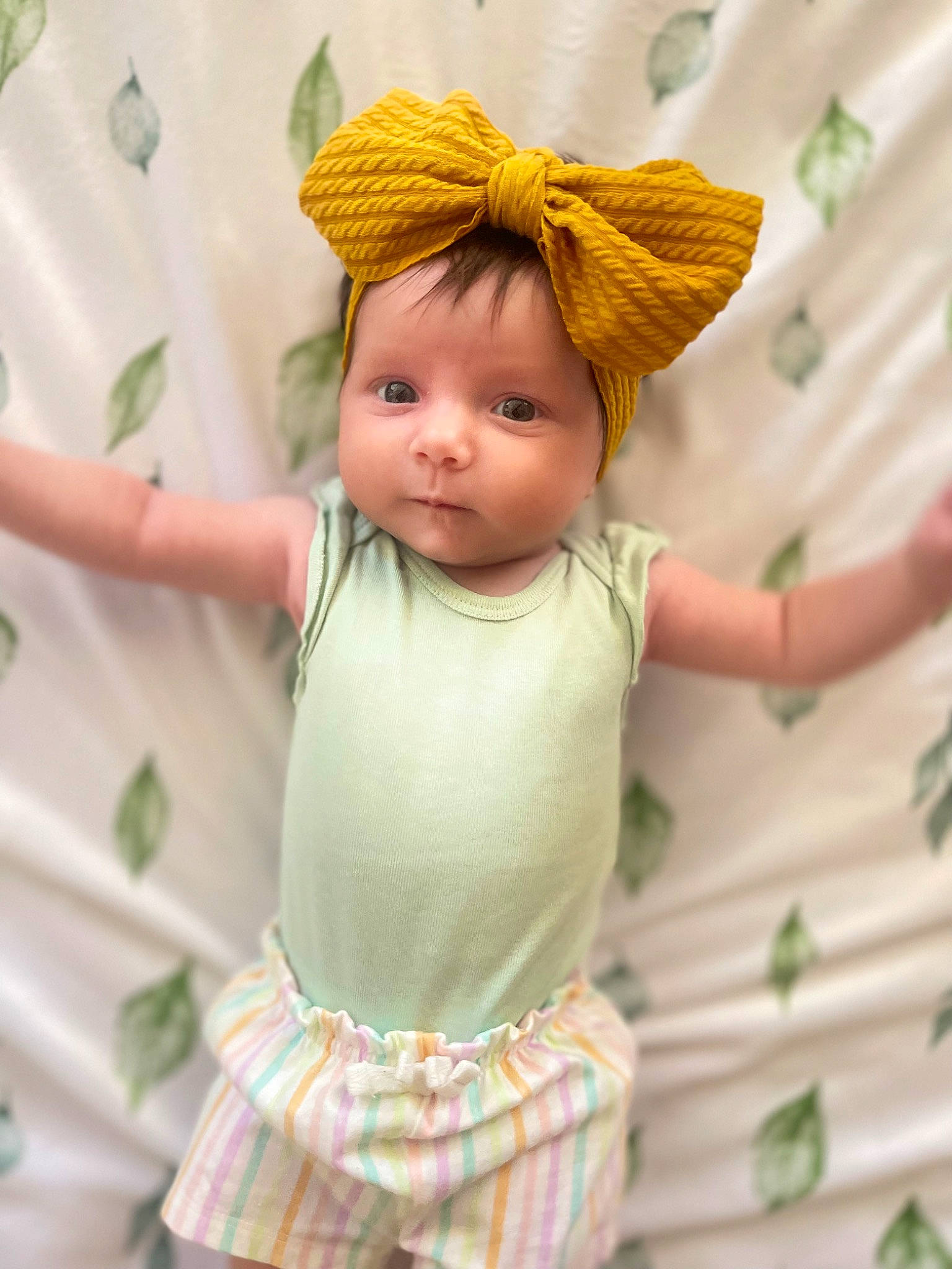 Genevieve is registered to the contest to win money with this photo: abdomen, baby_toddler_clothing, child, eye, eyelash, face, fawn, fun, hair, happy, head, headband, headpiece, human_body, iris, person, pink, sleeve, toddler, trunk