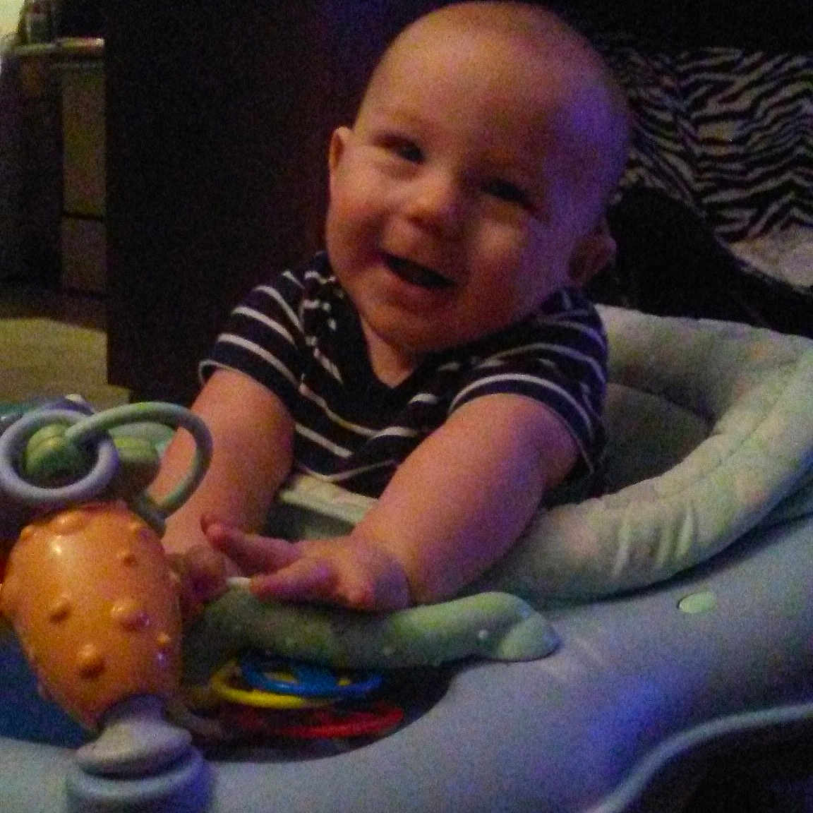 Dwight is registered to the contest to win money with this photo: child, cool, eye, fun, girl, head, infant, person, play, product, sitting, space, toddler