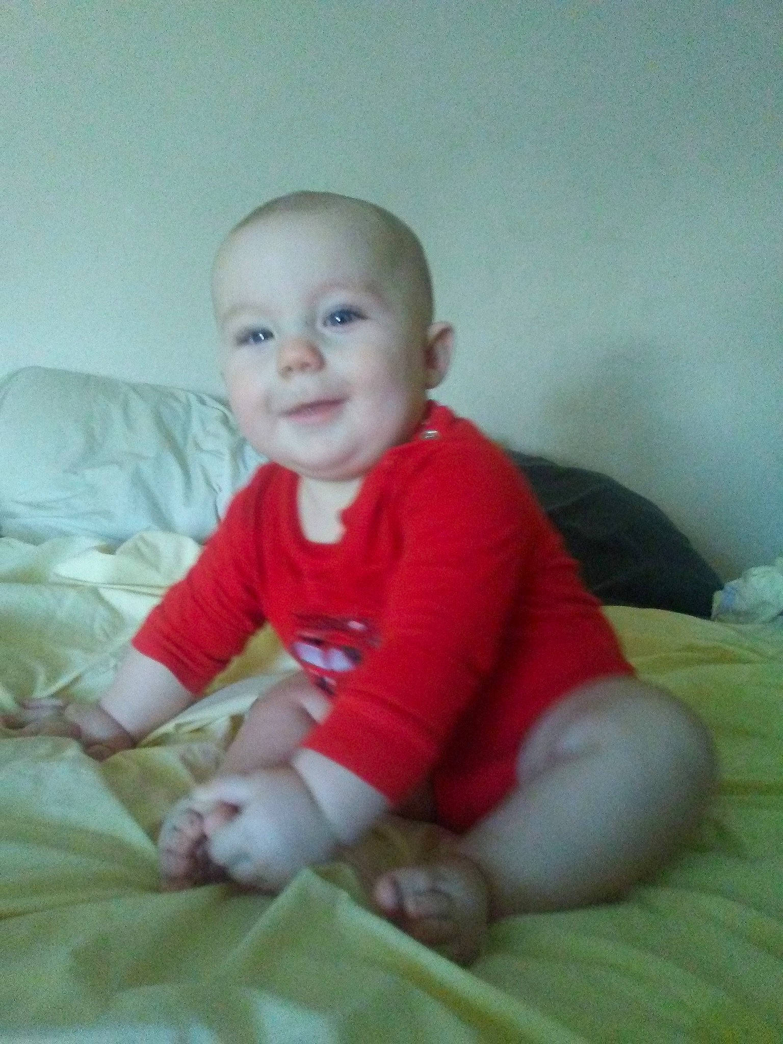 Dwight is registered to the contest to win money with this photo: boy, cheek, child, ear, eye, face, girl, head, human_hair_color, infant, iris, leg, mouth, nose, person, product, red, sitting, skin, smile