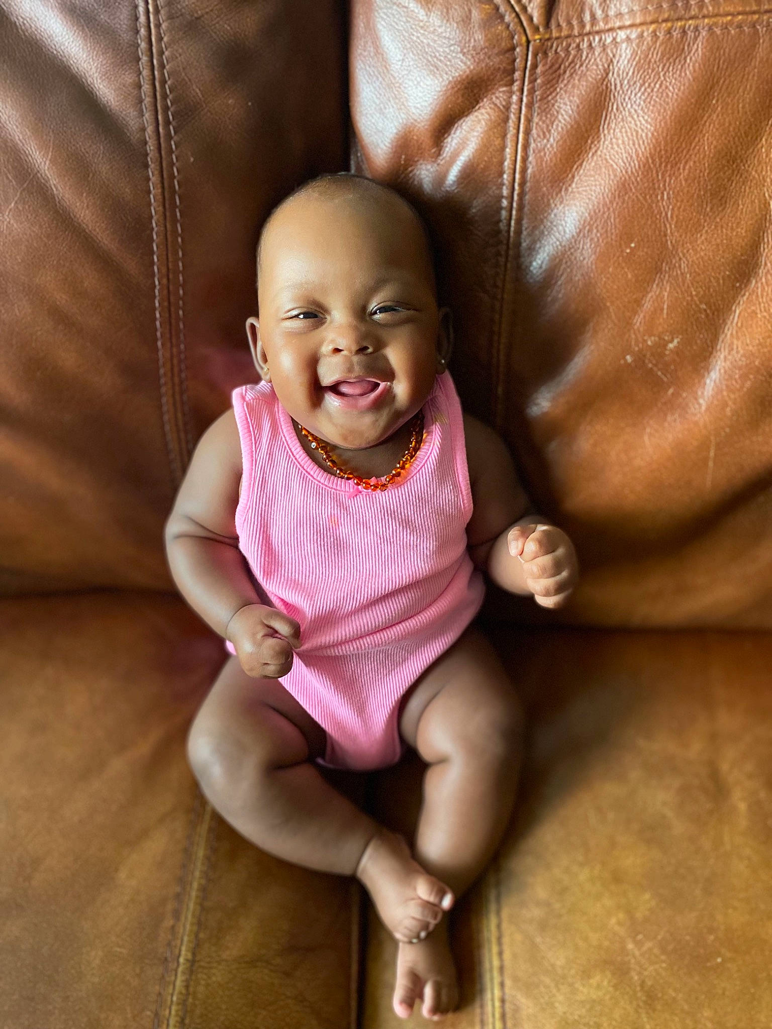 Kaylie joined the competition — help win amazing prizes! baby, baby_toddler_clothing, comfort, dress, eye, face, gesture, hairstyle, happy, head, human_body, joy, lip, mouth, nose, person, pink, skin, sleeve, smile