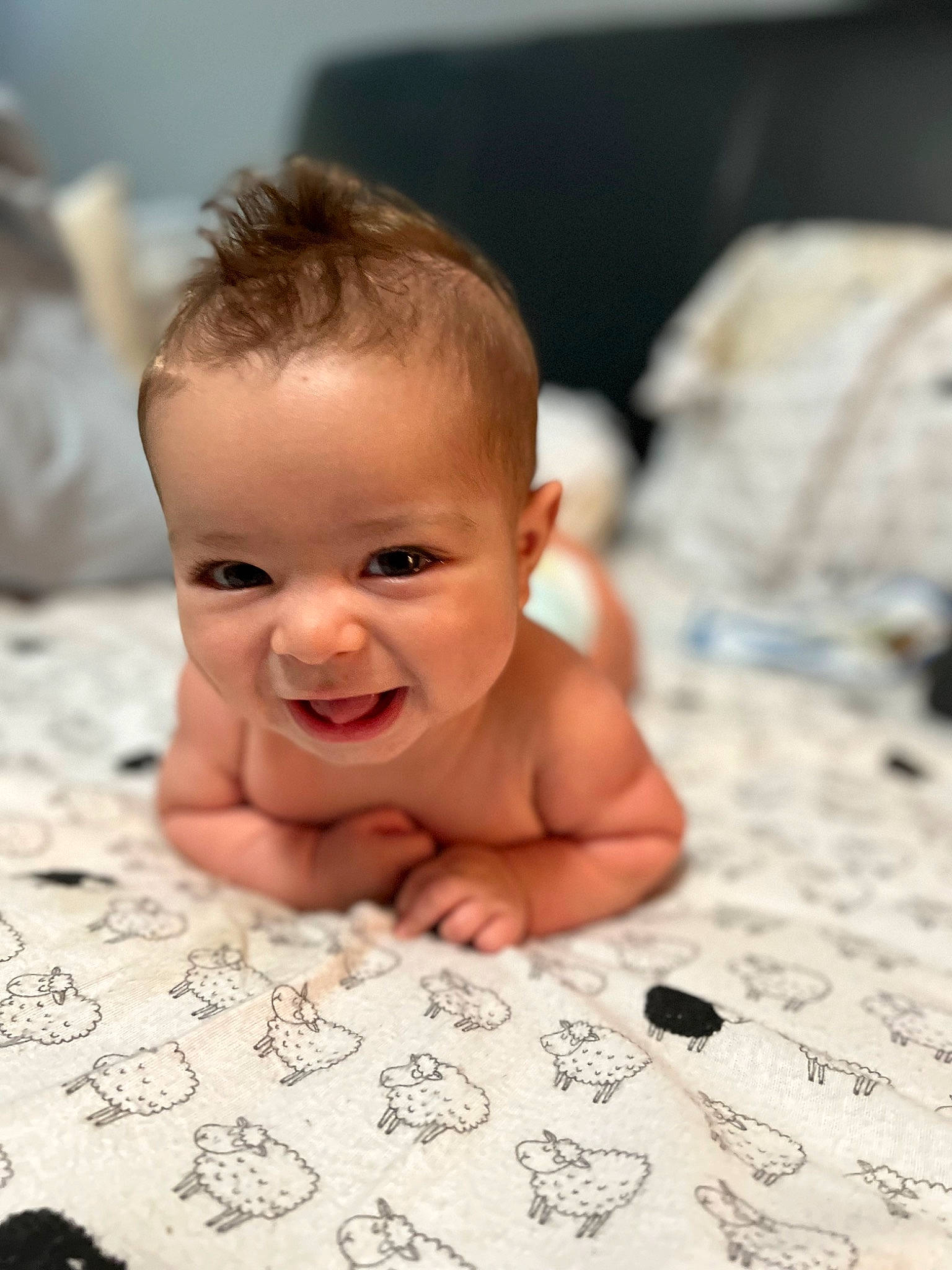 Ryker is registered to the contest to win money with this photo: baby, barechested, bathing, cheek, chest, child, eye, flash_photography, flooring, fun, happy, iris, linens, lip, monochrome, monochrome_photography, nose, person, skin, smile