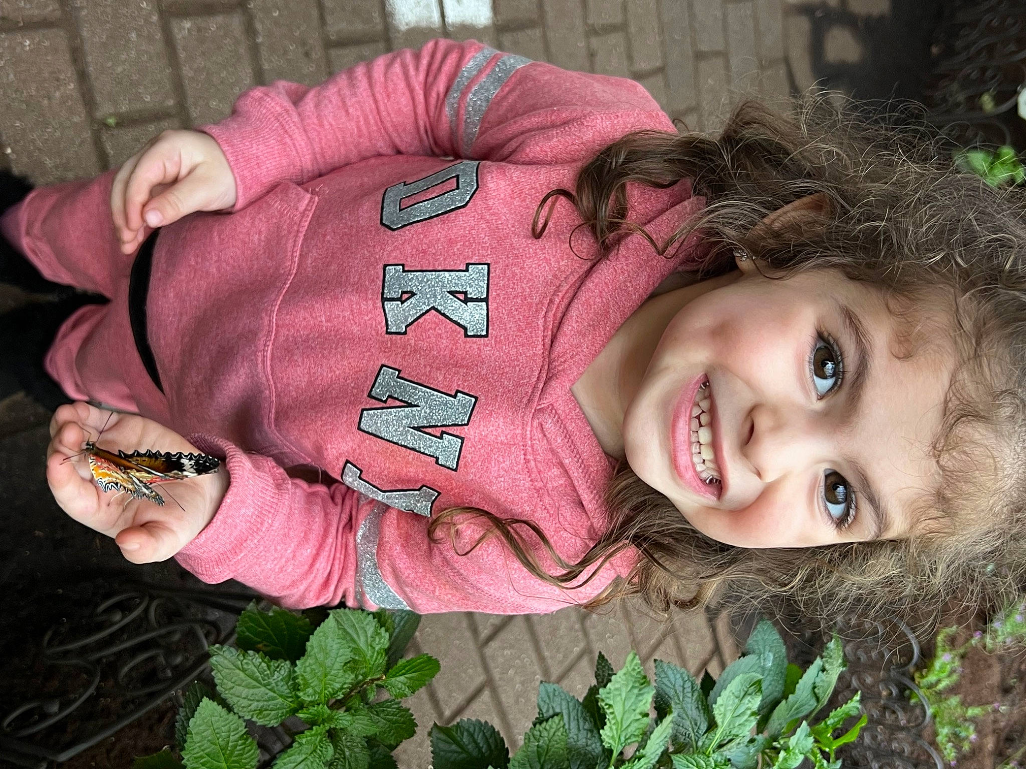 Sarai is registered to the contest to win money with this photo: botany, cool, eye, flower, grass, green, hairstyle, happy, joy, leaf, lip, mammal, mouth, organ, outerwear, people_in_nature, person, pink, plant, skin