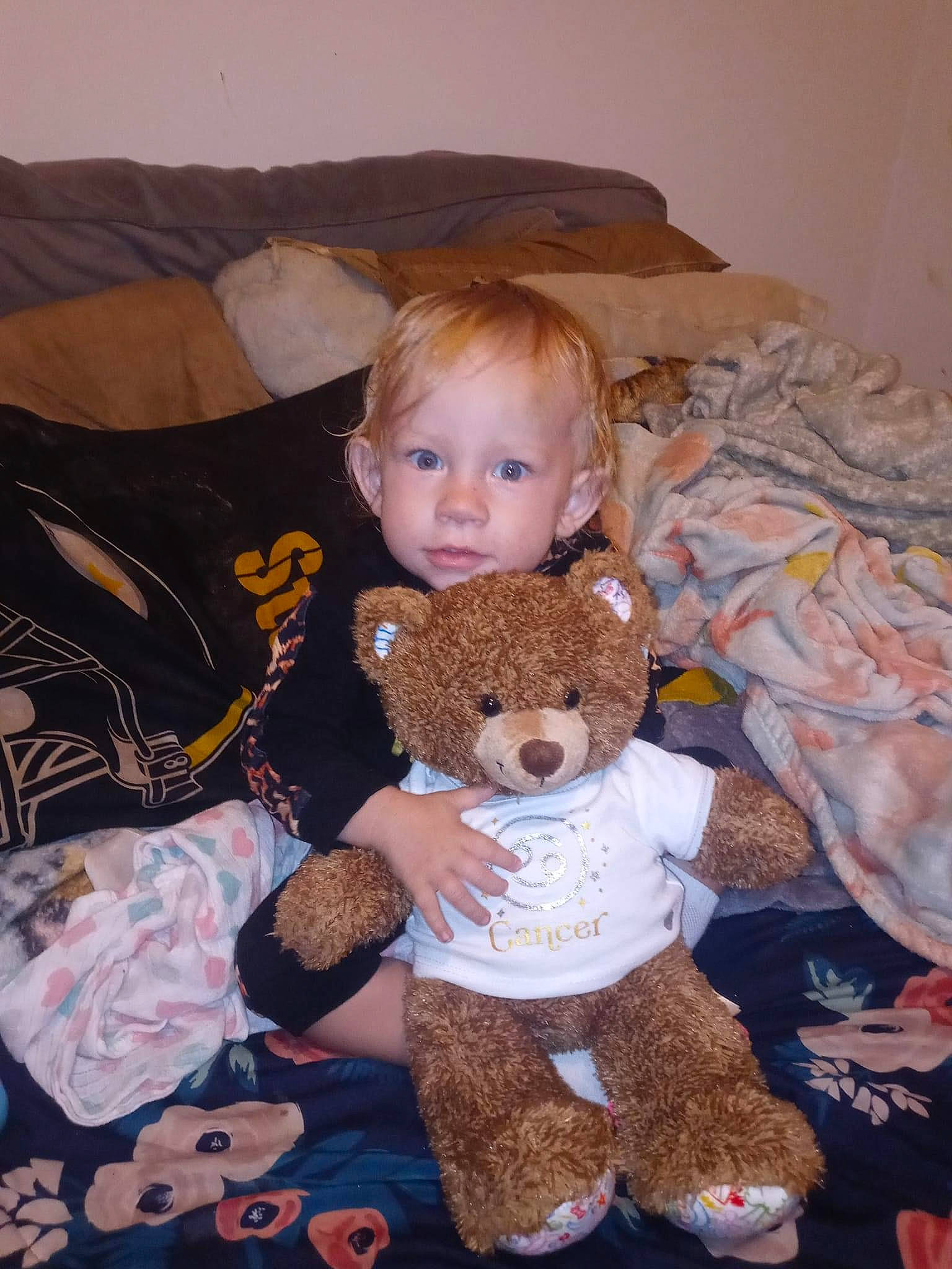 Alaiya is registered to the contest to win money with this photo: baby, baby_toddler_clothing, baby_toys, brown, brown_hair, cheek, child, comfort, doll, fawn, fur, lap, linens, pattern, person, plush, room, sleeve, stuffed_toy, toddler