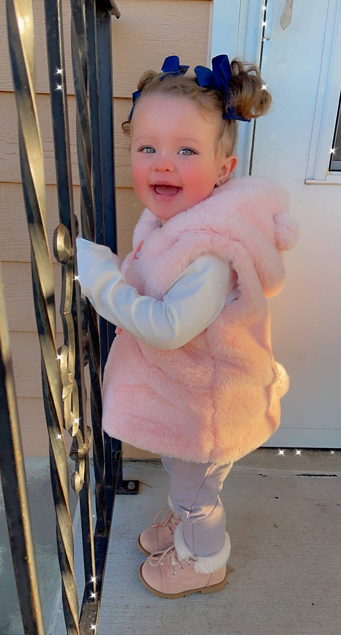 Georgia is registered to the contest to win money with this photo: baby, baby_toddler_clothing, cheek, child, electric_blue, face, fun, fur, fur_clothing, happy, person, photograph, picture_frame, pink, recreation, sitting, skin, sleeve, smile, toddler