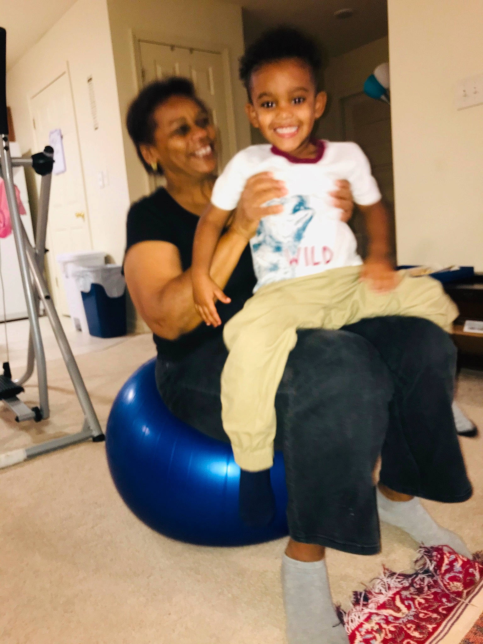 Eli is registered to the contest to win money with this photo: arm, ball, child, exercise_equipment, furniture, joint, joy, leg, leisure, person, physical_fitness, shoulder, sitting, swiss_ball, toddler