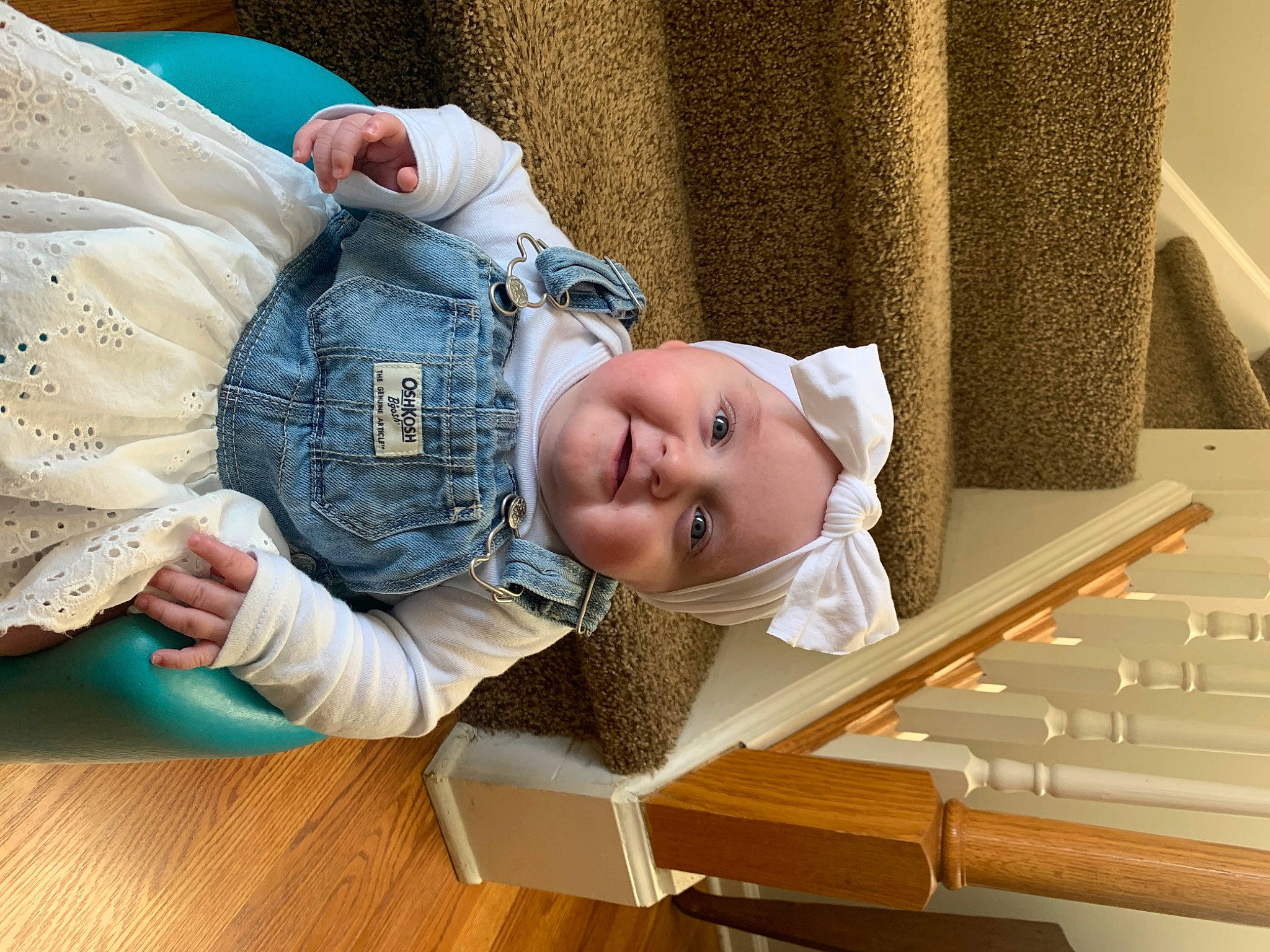 Raya is registered to the contest to win money with this photo: baby, baby_products, baby_toddler_clothing, cheek, child, comfort, denim, flooring, glasses, happy, hardwood, headwear, joy, nap, person, portrait_photography, product, room, sitting, skin